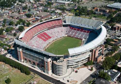 Tuscaloosa, Alabama, USA - August 12, 2010: Construction trucks and cherry pickers can be seen as final touches are being added to renovations at Bryant-Denny Stadium, home of the University of Alabama Crimson Tide football team.